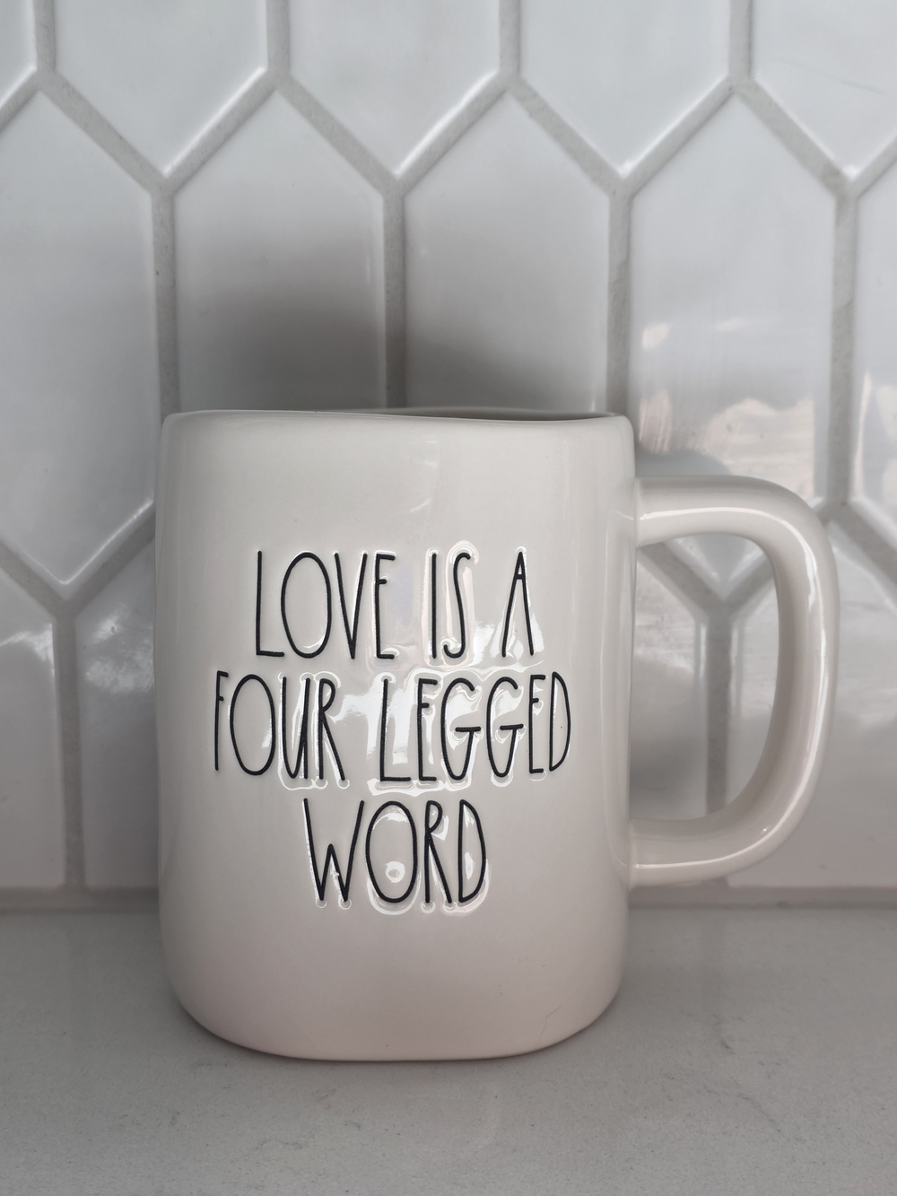 Rae Dunn White Ceramic Mug with Black Lettering - 'Love Is A Four Legged Word'